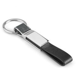 Travolta sada vizitkáře a klíčenky